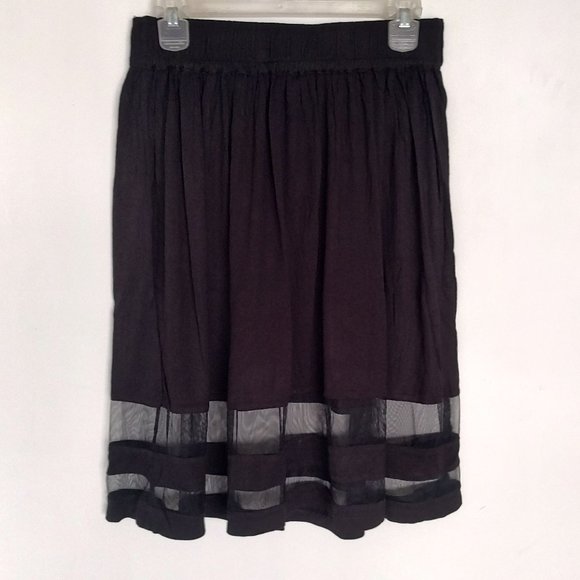 Candie's black knee length skirt with net work at bottom and elastic waist band